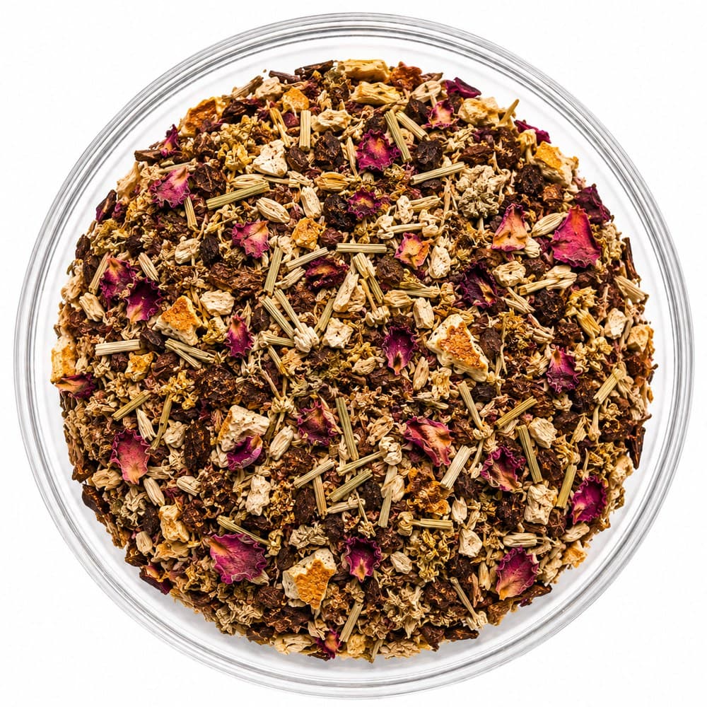 Amber Nightcap™ loose-leaf blend in a glass bowl — russet and amber botanicals with rose petals and orange peel