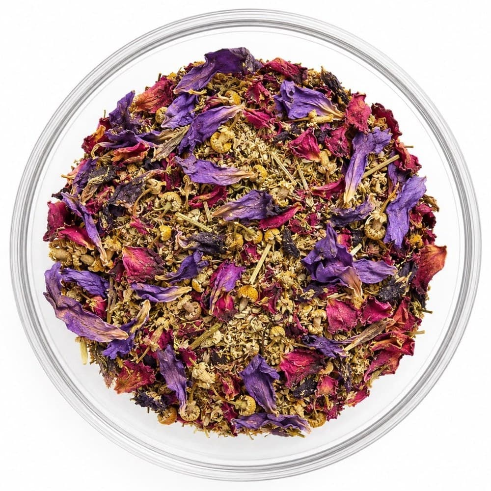 Dream Door™ loose-leaf blend in a glass bowl — chamomile with violet and magenta petals